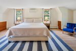 Second story primary bedroom with a king bed